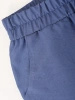 Niebieski komplet damski ze spodniami jeans – luźny fason z dekoltem w serek i paskiem 39952