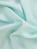 Zielona sukienka na wesele w kwiaty z narzutką – prosty fason wysmuklający sylwetkę 32972
