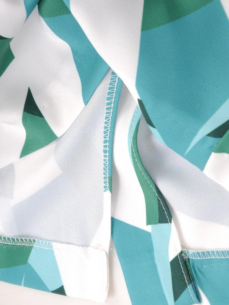 Zielona sukienka midi w geometryczny print – tuszujący prosty krój z ozdobnymi patkami 35505