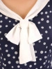 Wizytowa sukienka rozkloszowana w grochy – modelujący sylwetkę fason z kokardą 33315