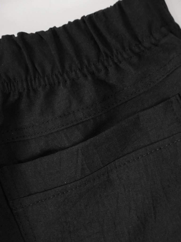 Eleganckie czarne spodnie damskie z szerokimi nogawkami – wygodna guma w pasie i wysoki stan 38368