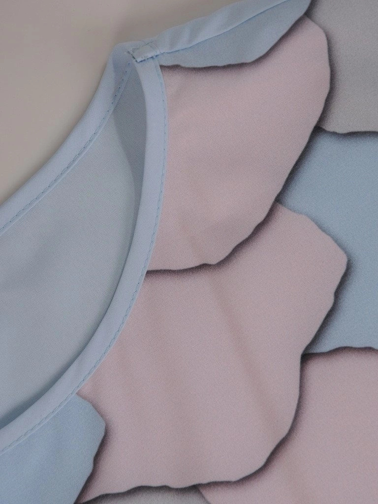Wizytowa bluzka damska w pastelowy wzór – efektowne wiązanie modelujące sylwetkę 11566